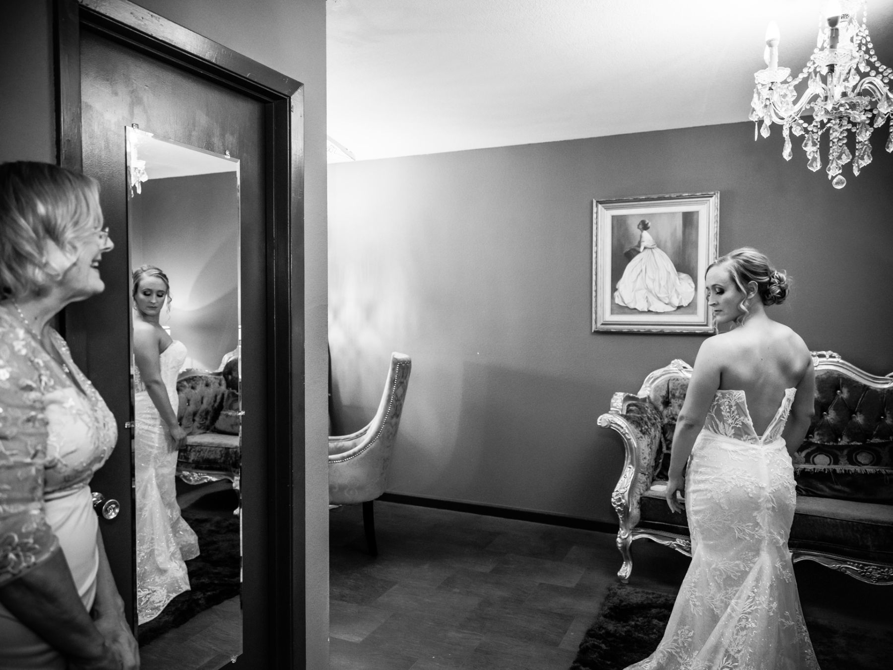 Bride poses in bridal suite as she is getting ready for wedding at The Vistas on Seward Hill.